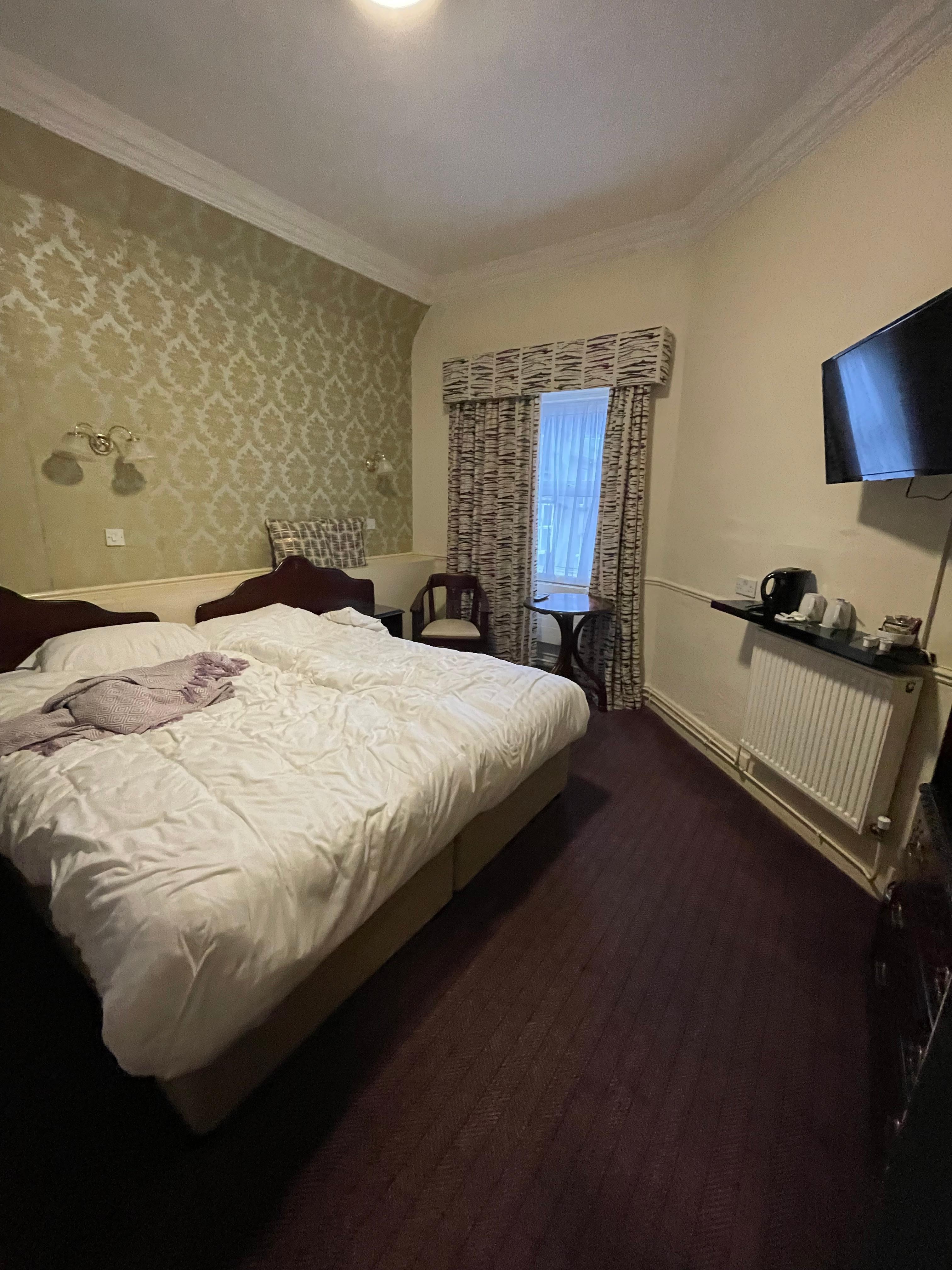 Room 7 upon checkout, the most accessible outlets were to the left of the shelf under the TV