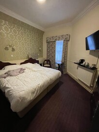 Room 7 upon checkout, the most accessible outlets were to the left of the shelf under the TV