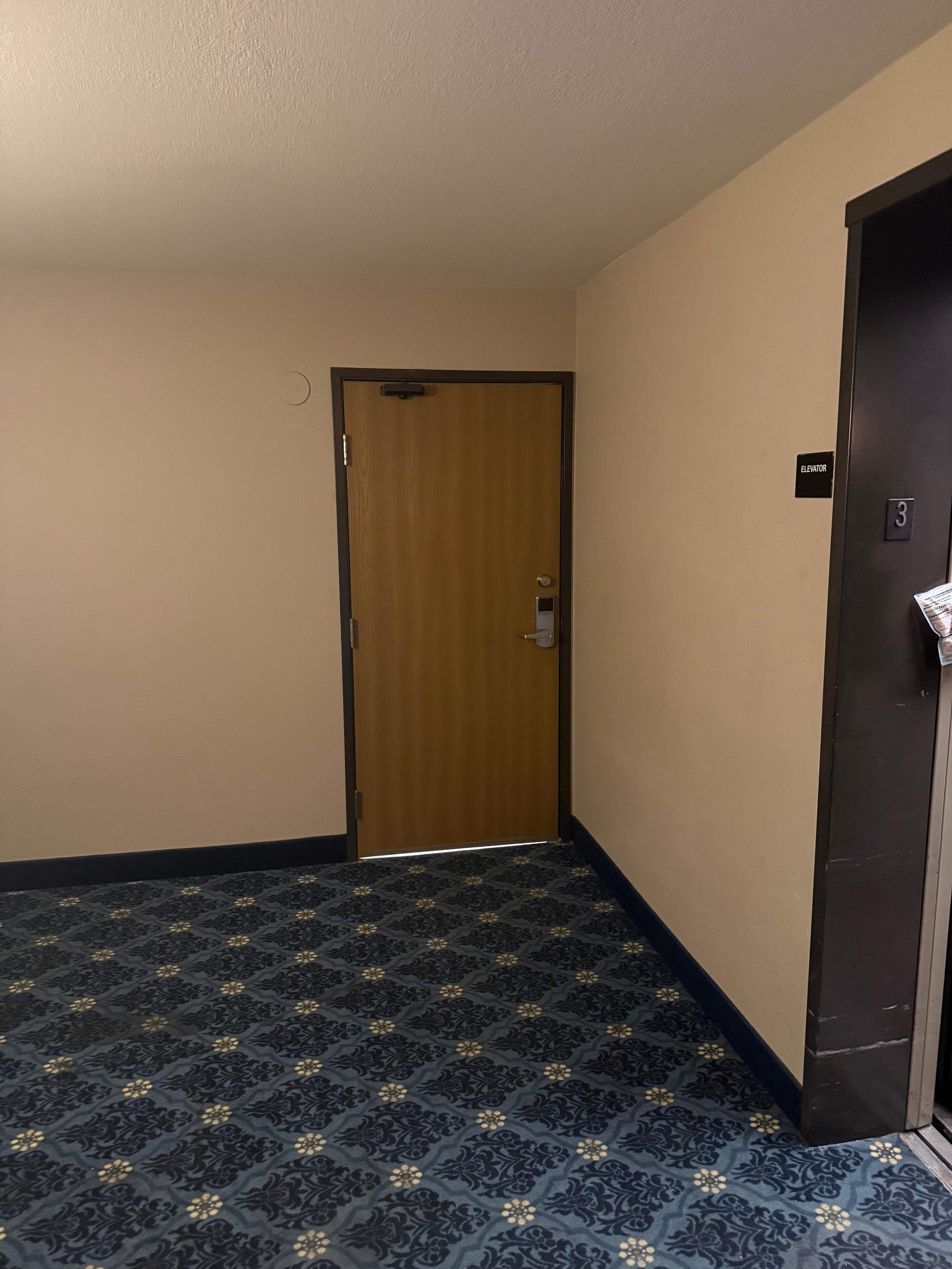 Dark hallway waiting for elevator 