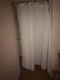No bathroom door, just a curtain that didn't close all the way