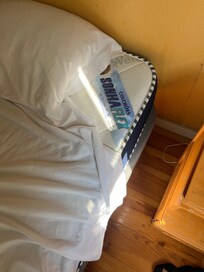 The lack of a fitted sheet on the bed
