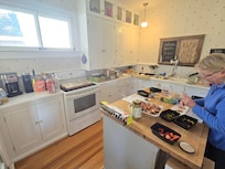 Spacious, fully-stocked kitchen.