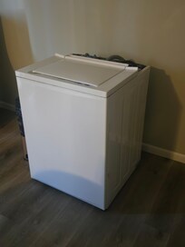 Part of the washing machine in the living room