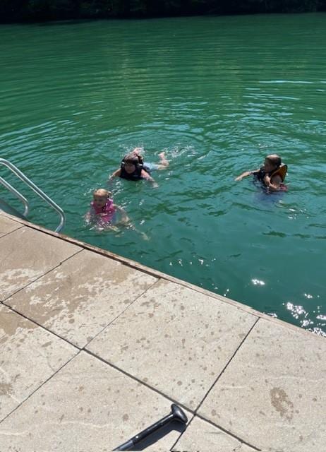 Kids swimming off the dock
