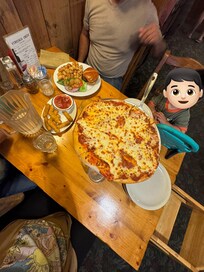 Eating dinner in their location.