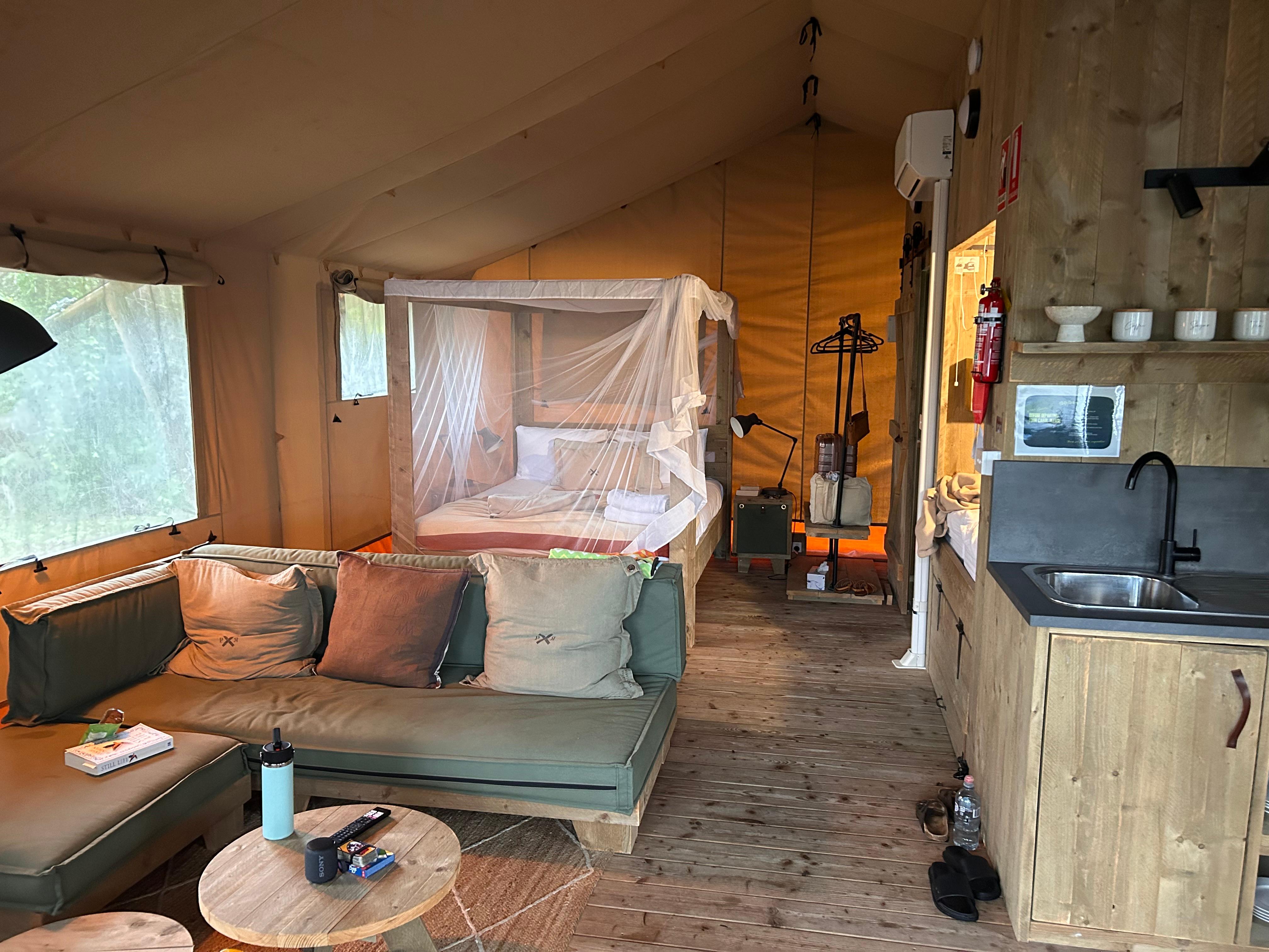 Living and main bed - kids bed in the nook behind the kitchen area. 