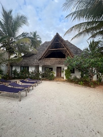 Looking back at the house from the gate to the beach