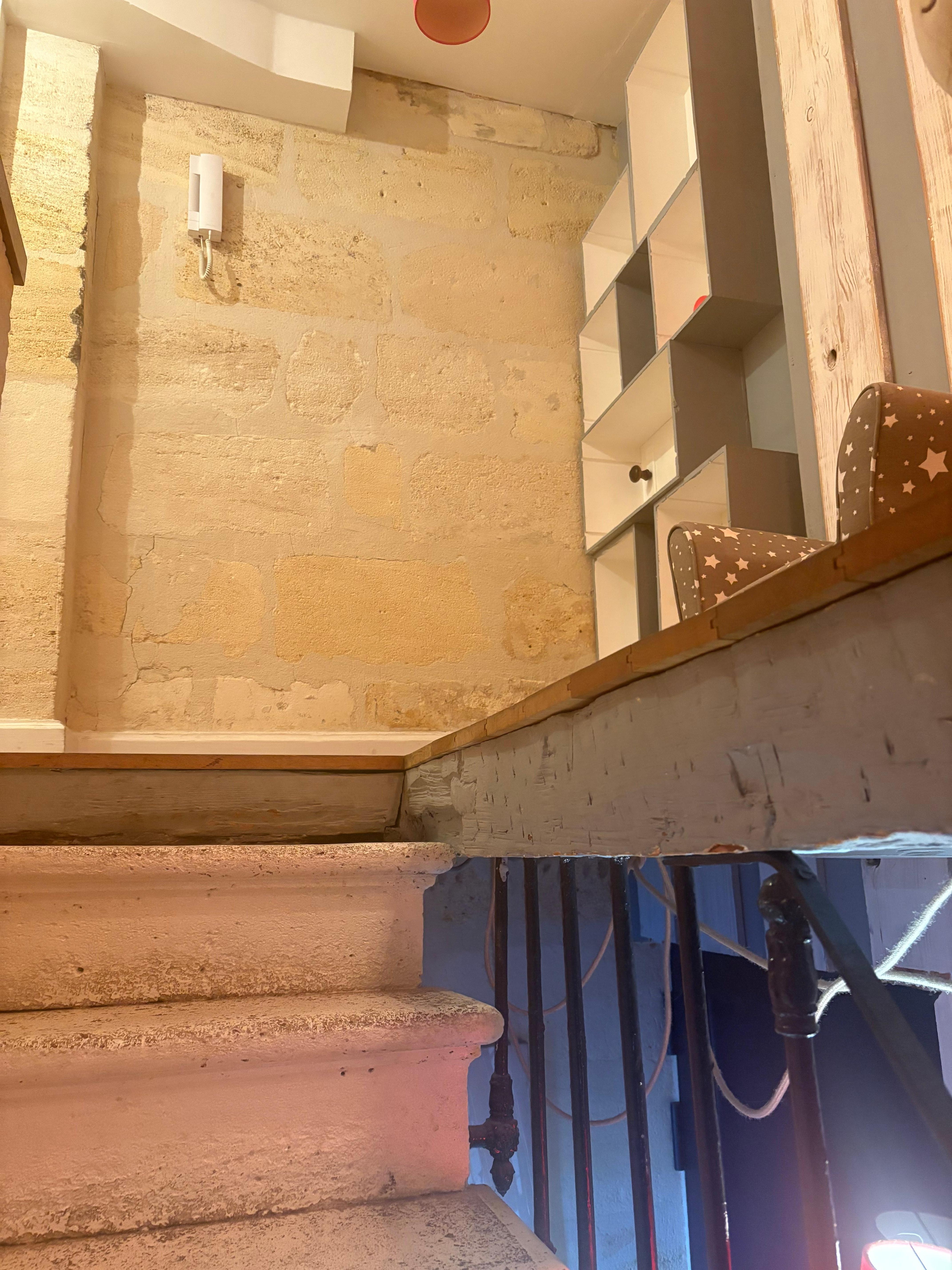Top of stairs. Note no handrails on four steps