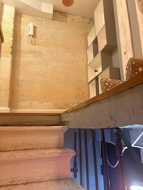 Top of stairs. Note no handrails on four steps