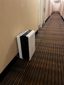 One of the dehumidifiers in a hallway.