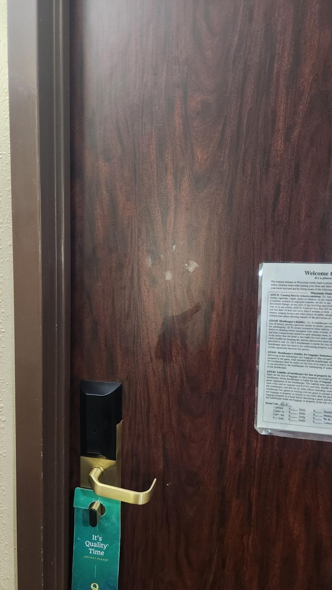 Greasy handprints on door