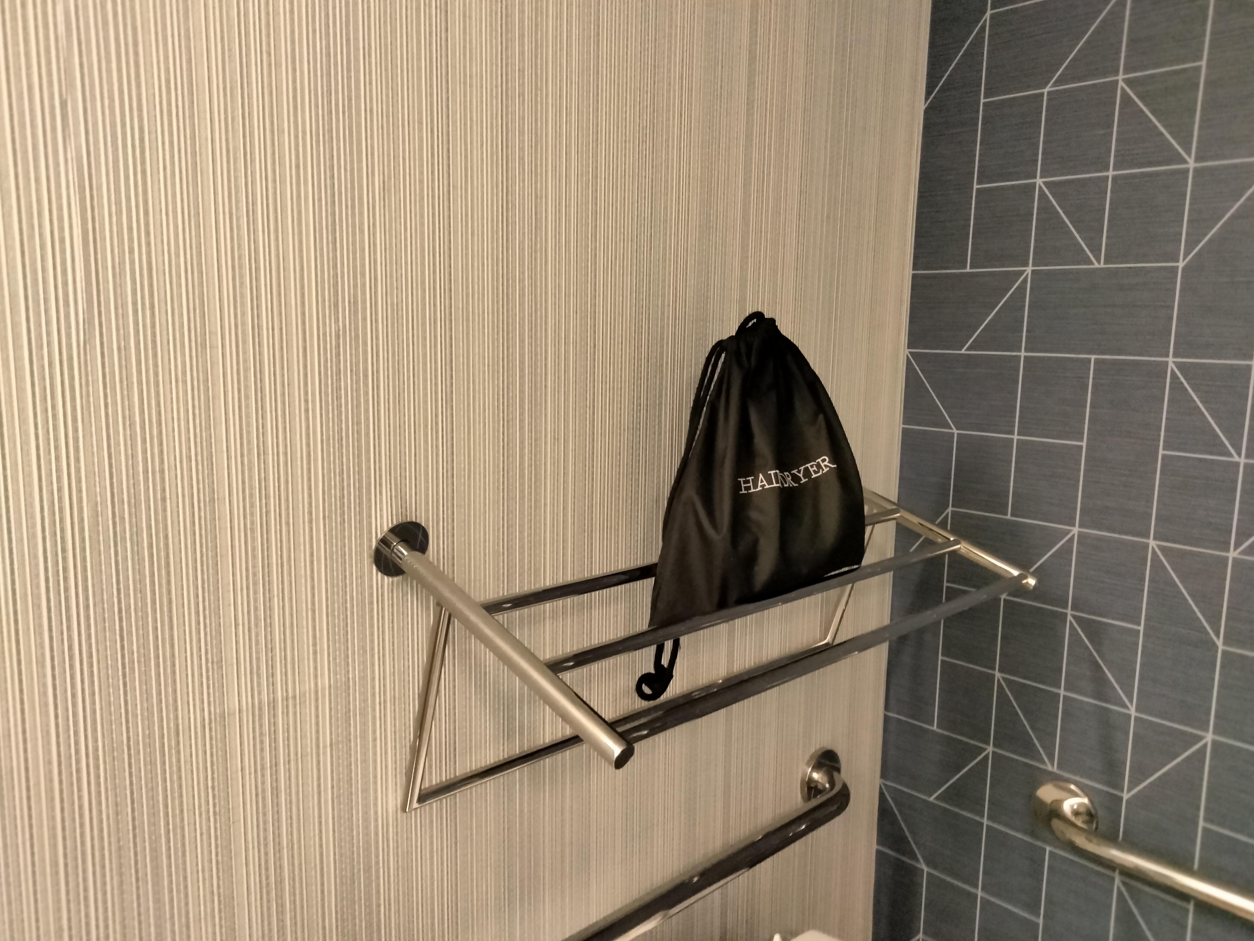 Towel rack pulled out from wall.