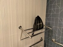 Towel rack pulled out from wall.