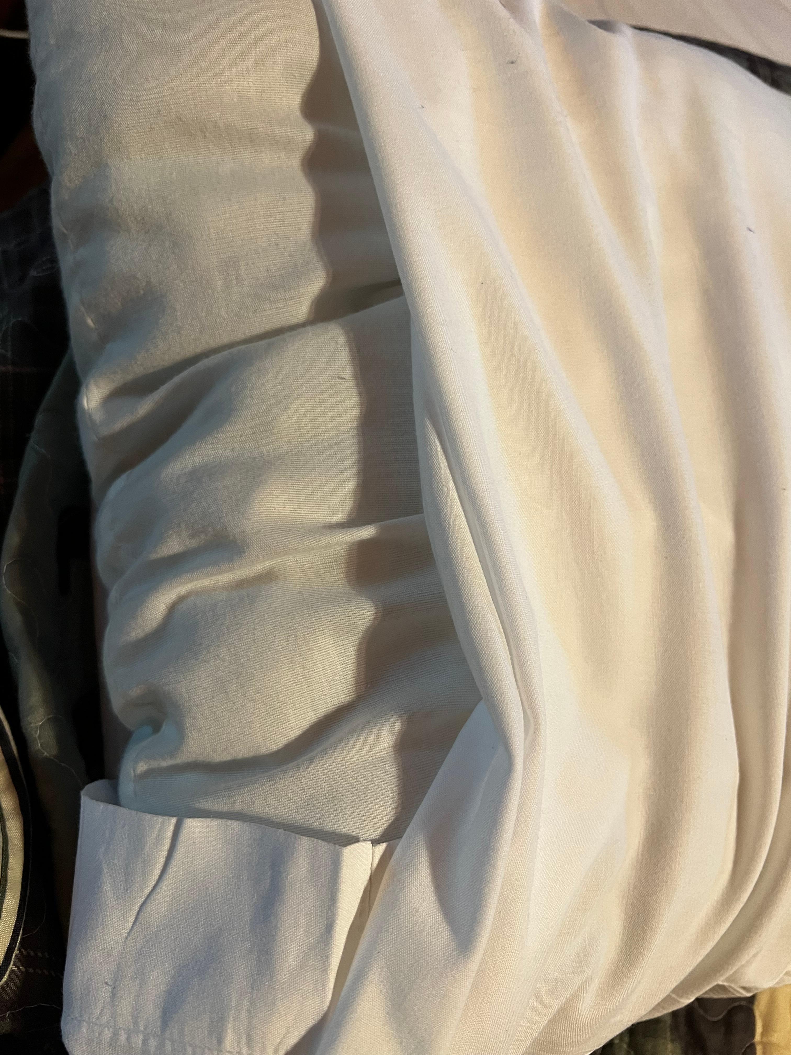 Lovely charcoal gray pillow to lay on. Gross!