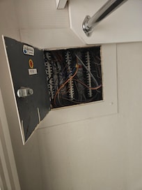 Panel left open, definitely a safety hazard.