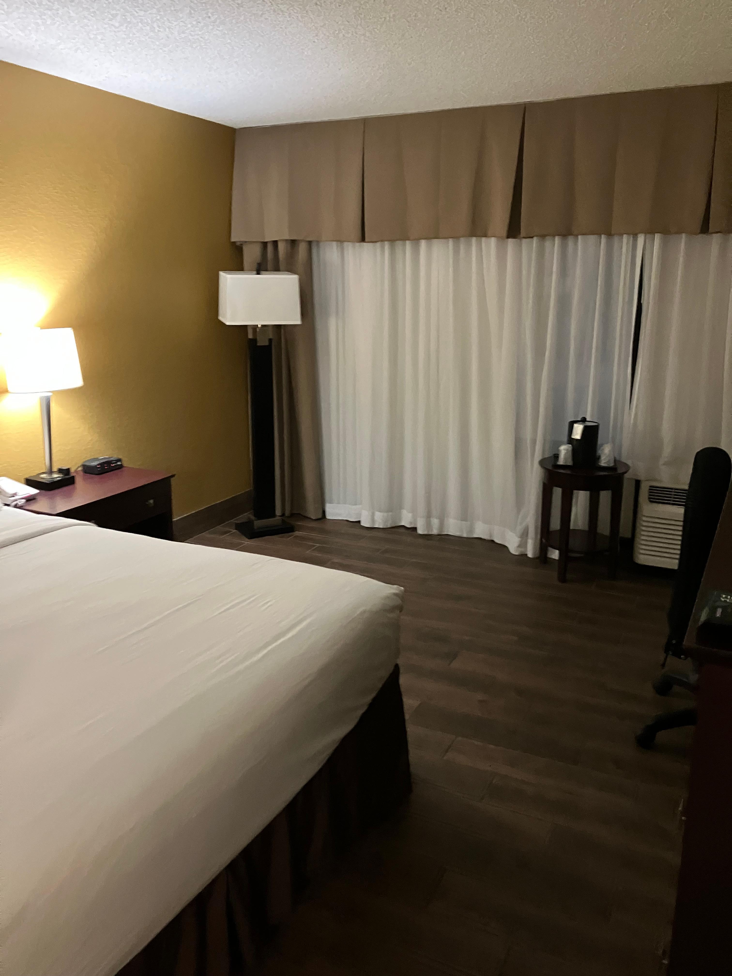 Missing the armchair. Nowhere to sit, but the office chair or the bed.