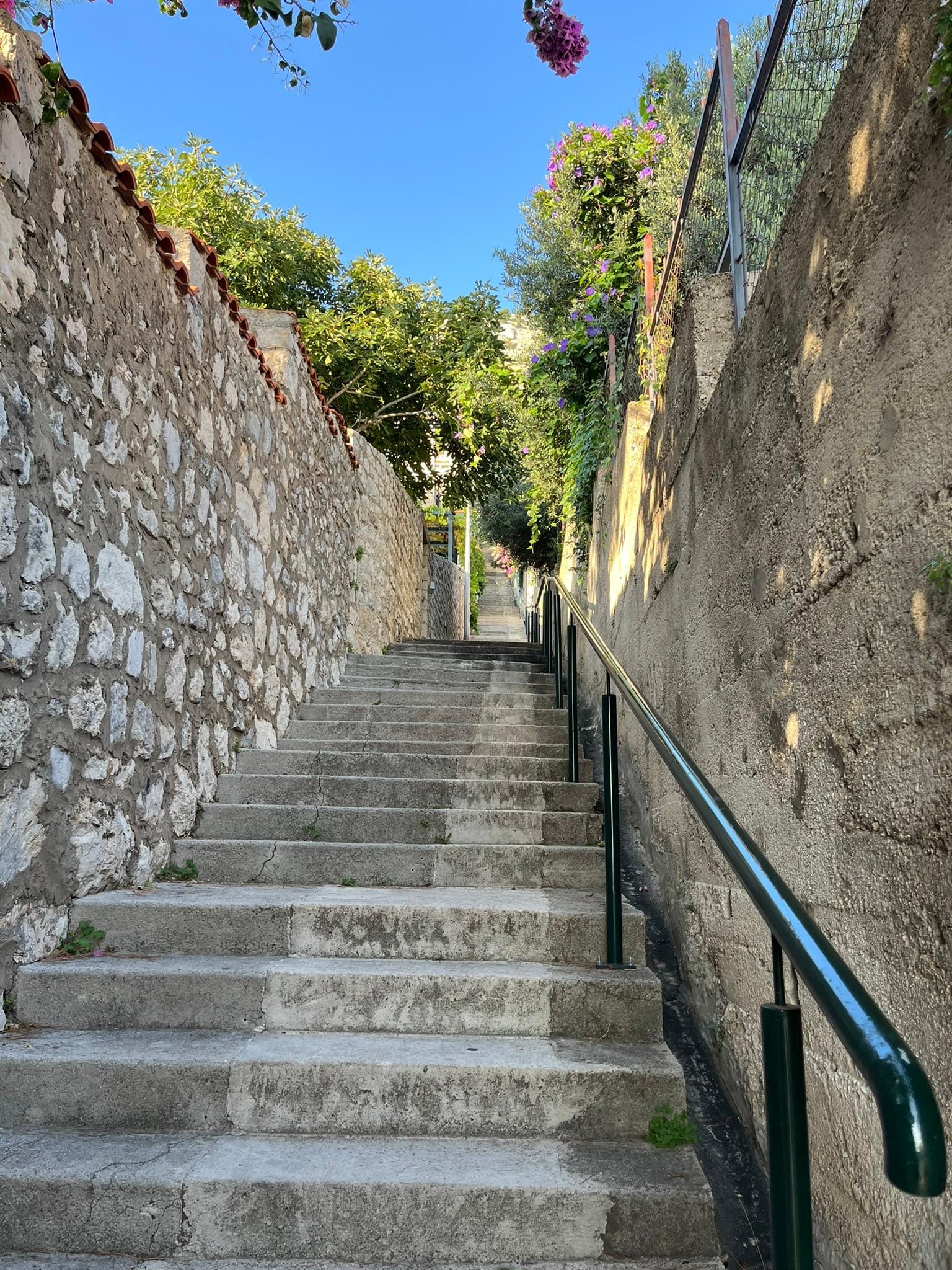 The stairs from the main road up to the apartment