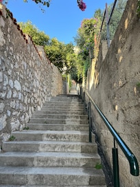 The stairs from the main road up to the apartment