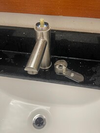 Damaged sink faucet with missing handle