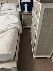 Absolutely no room to move in the primary bedroom because of bulky furniture