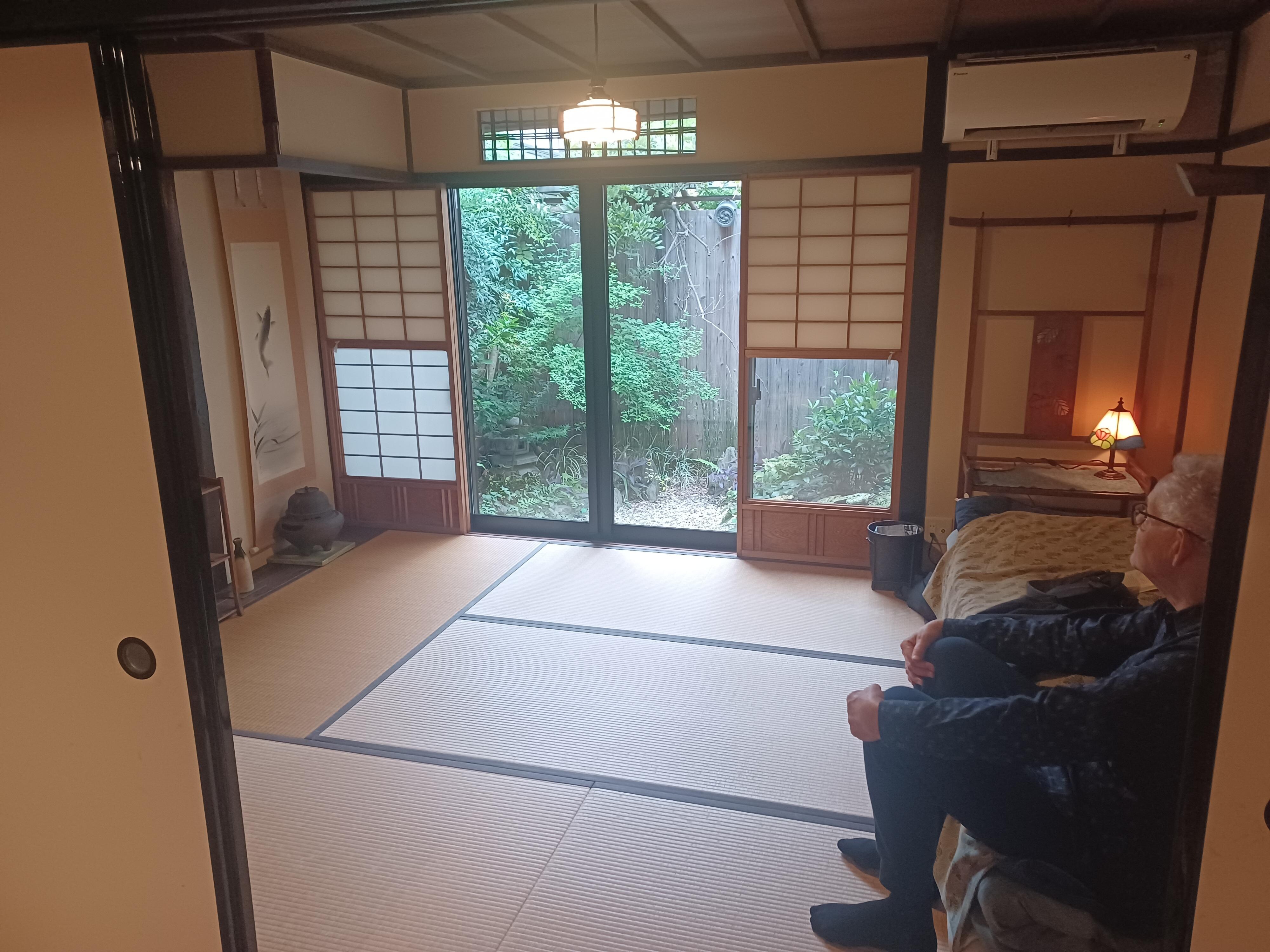 Sleeping room looking out onto small gatden