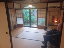 Sleeping room looking out onto small gatden