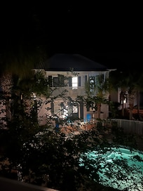 View from the balcony at night-another adorable bungalow. Very quiet and peaceful.