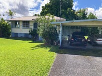 Front of house and carport.