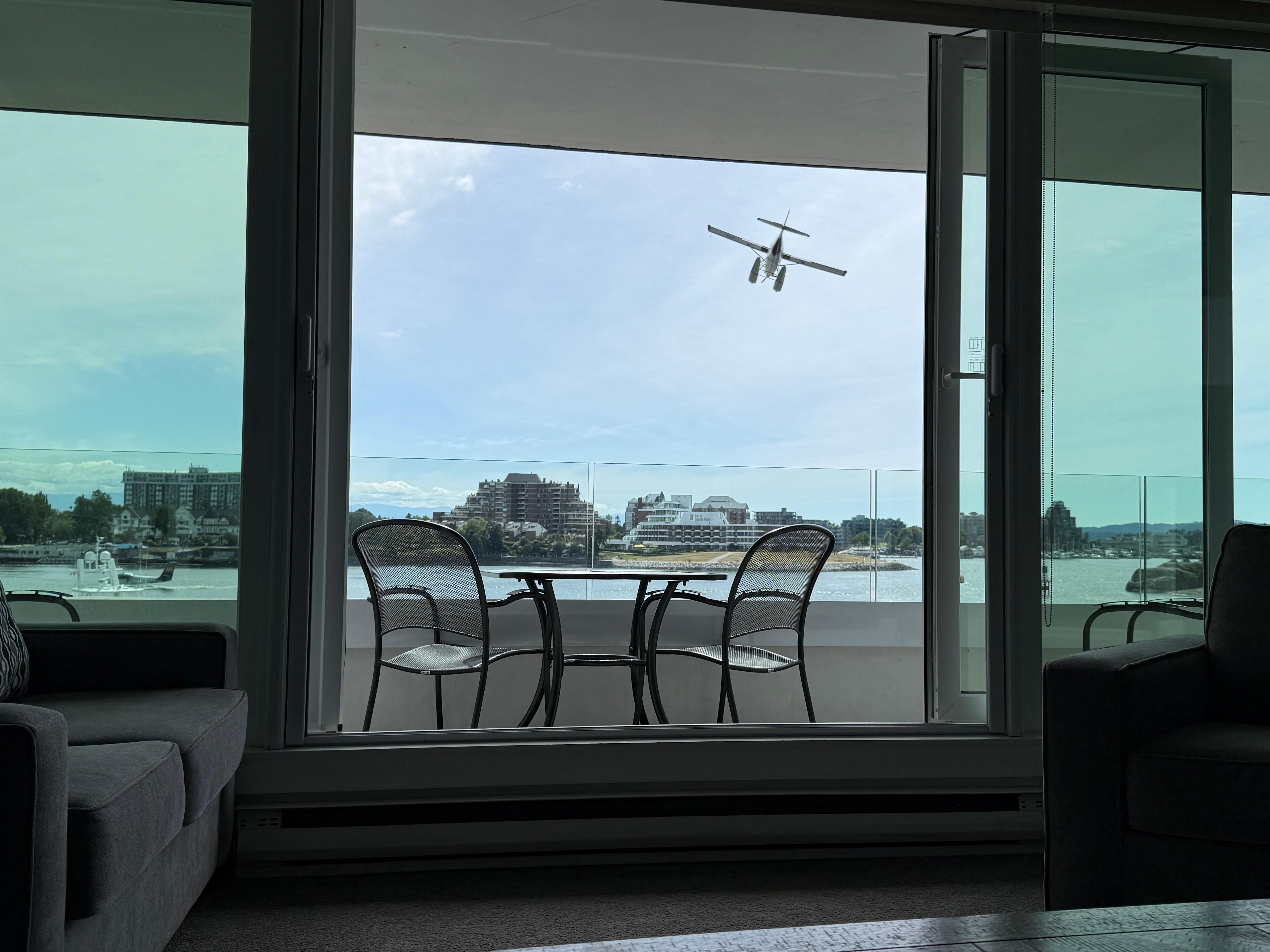 View of seaplanes, boats, and ferries from suite. 