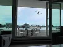View of seaplanes, boats, and ferries from suite.