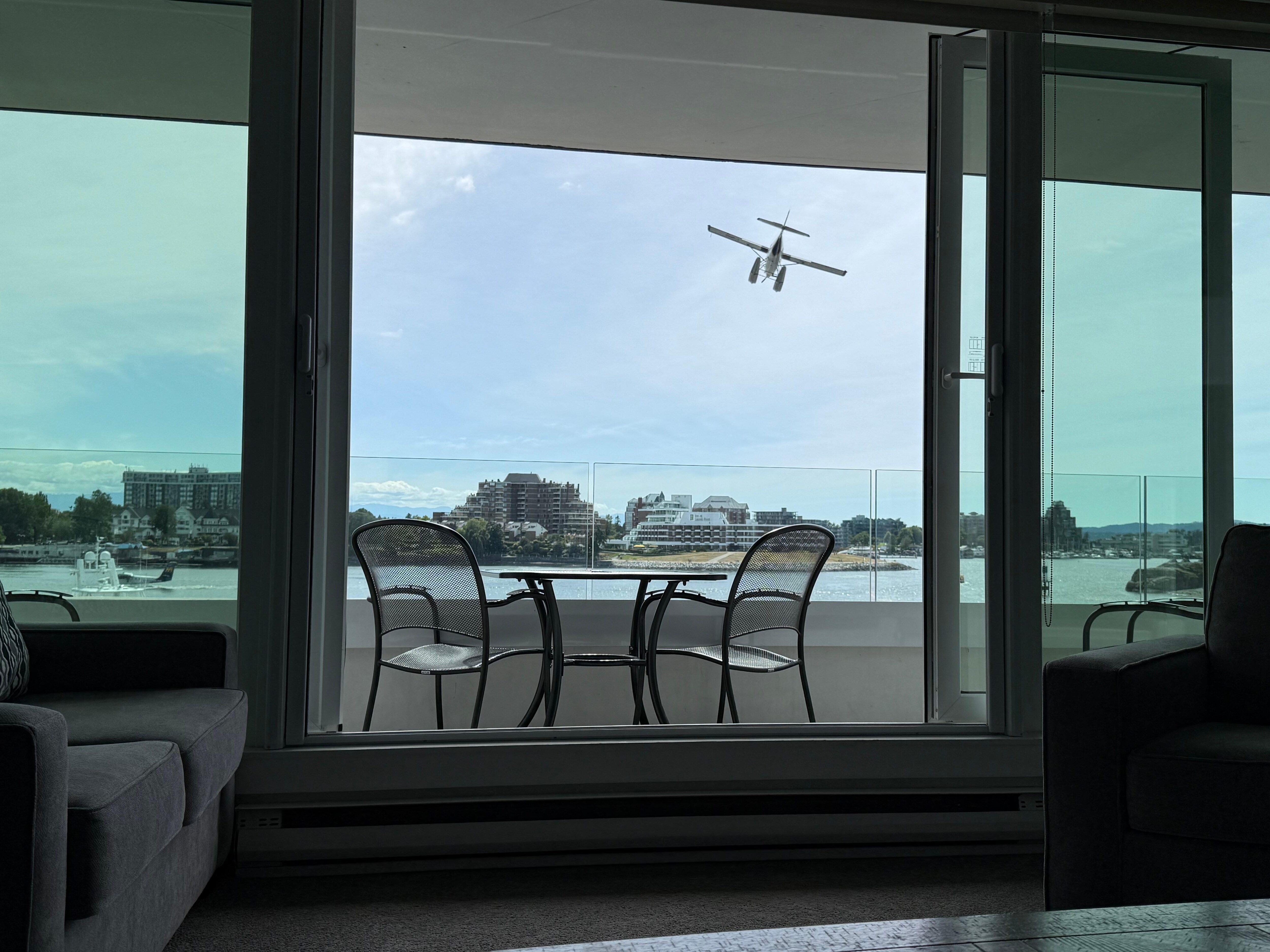 View of seaplanes, boats, and ferries from suite. 