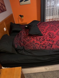 The bad was made.. It looks unmade here because I moved the pillows etc