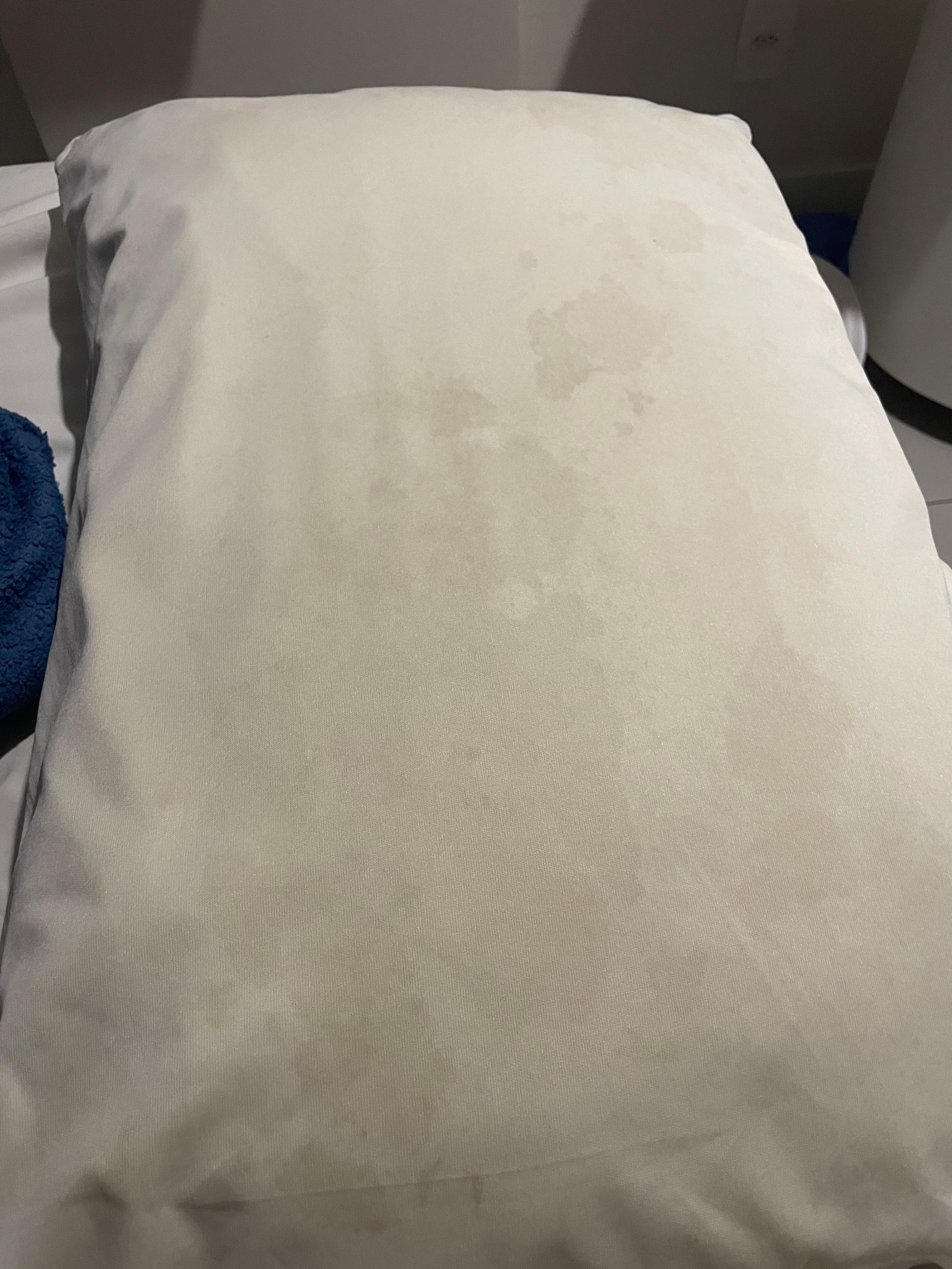 Stained pillow smells bad 