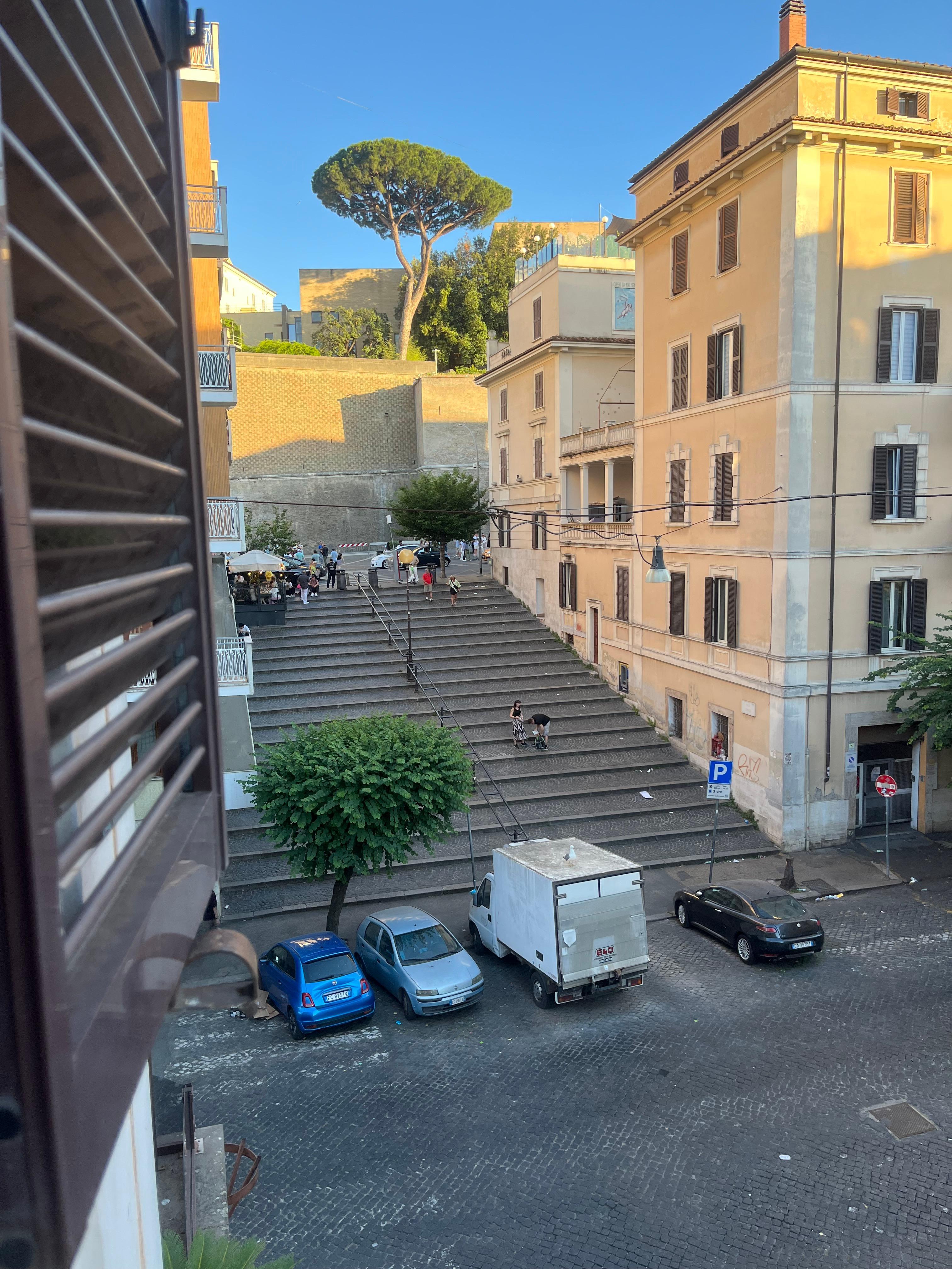 View of the Vatican museum wall from the room and location for tour is the bottom of the steps.