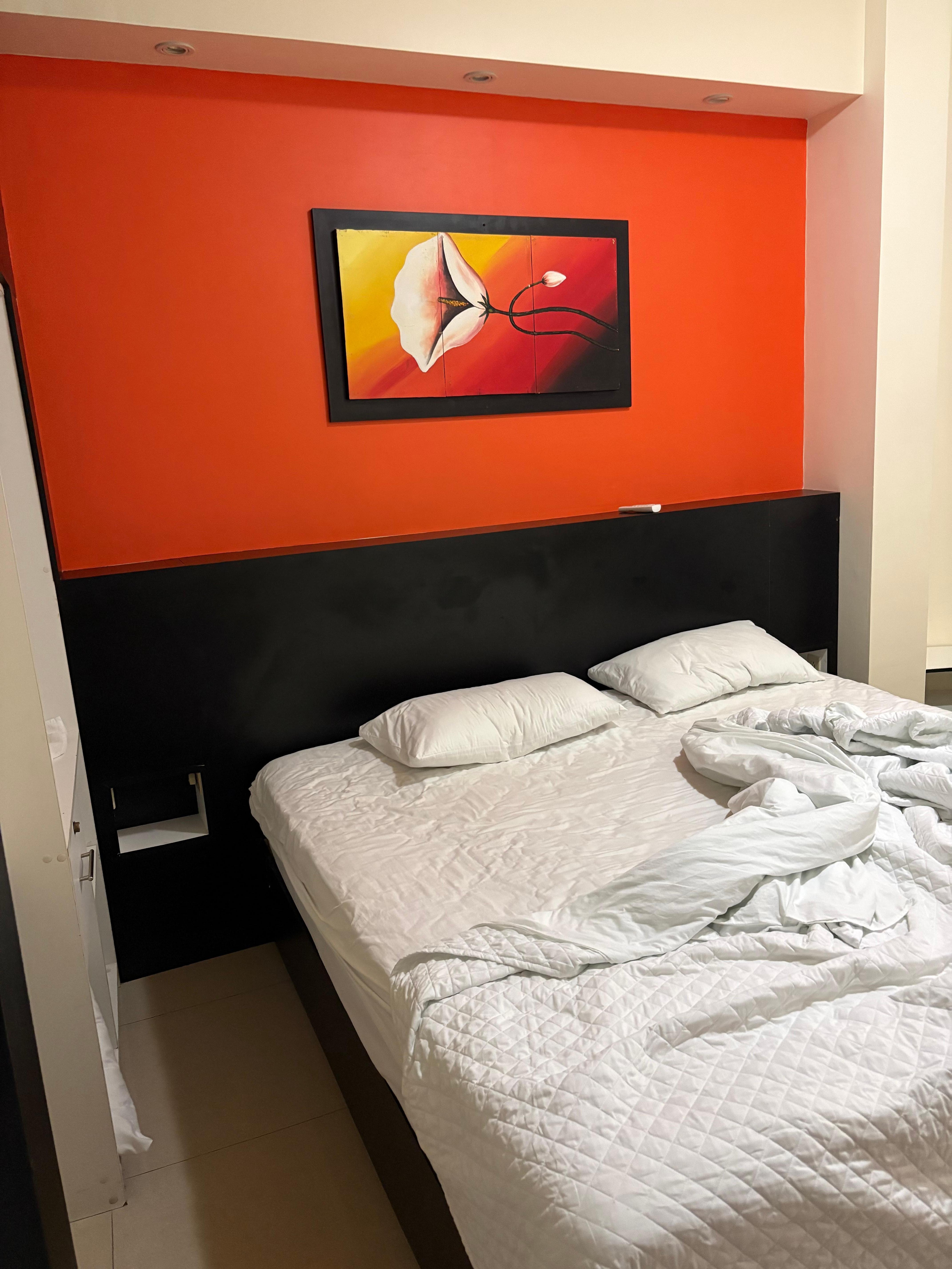 Standard room - spacious king bed. Lots of storage space & outlets. 