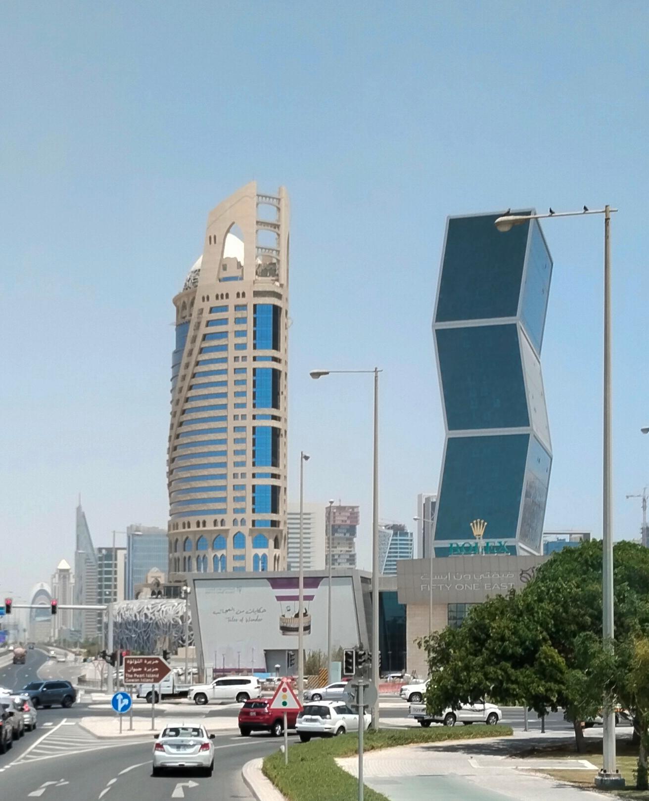 Daytime picture of hotel (on the left)