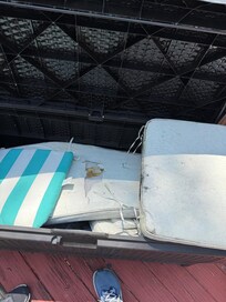 Patio furniture cushions moldy and torn. Wood furniture old and pealing