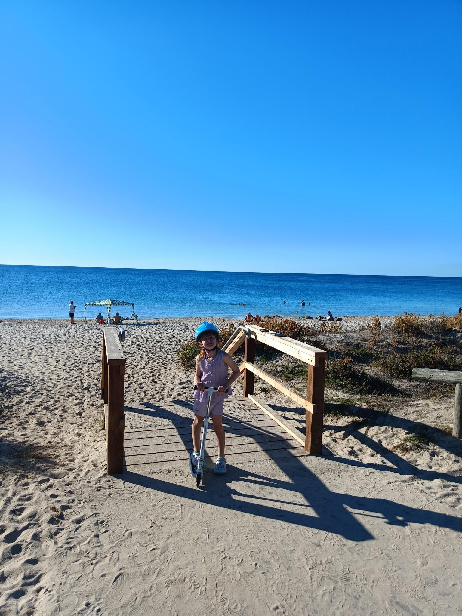 Olivia checking out how close the beach was to our cabin 1 min walk