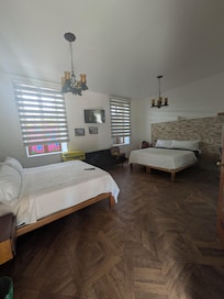 Room 10 on the ground level with two king beds looking from courtyard