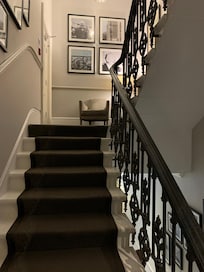Quaint staircase and classic feel, but there are elevators too!