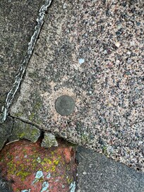 A quarter my grandpa put in the steps when he poured them.