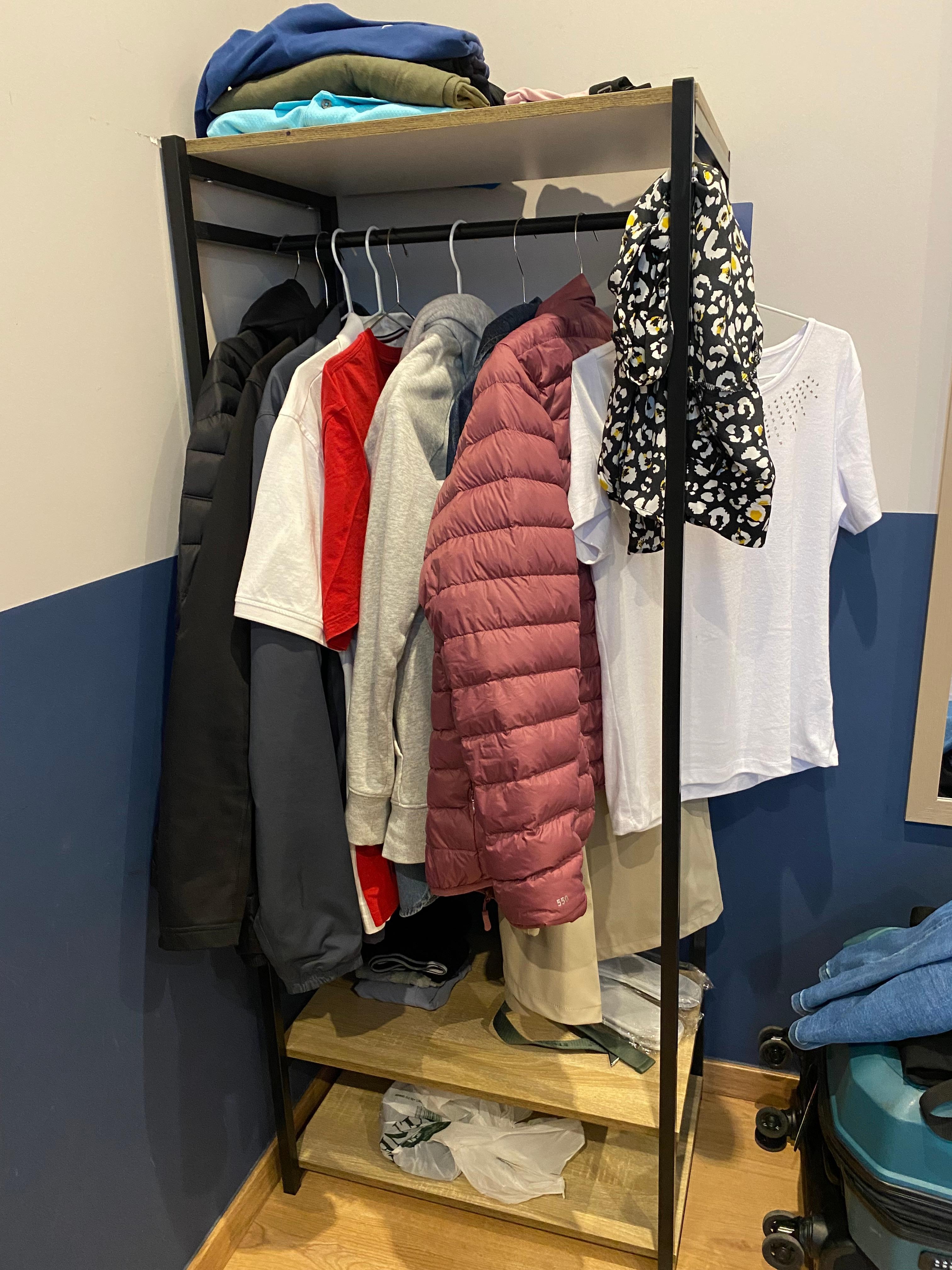 This was the entirety of the wardrobe space. We had 2 items together on each hangar. Also no drawer space