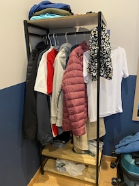 This was the entirety of the wardrobe space. We had 2 items together on each hangar. Also no drawer space