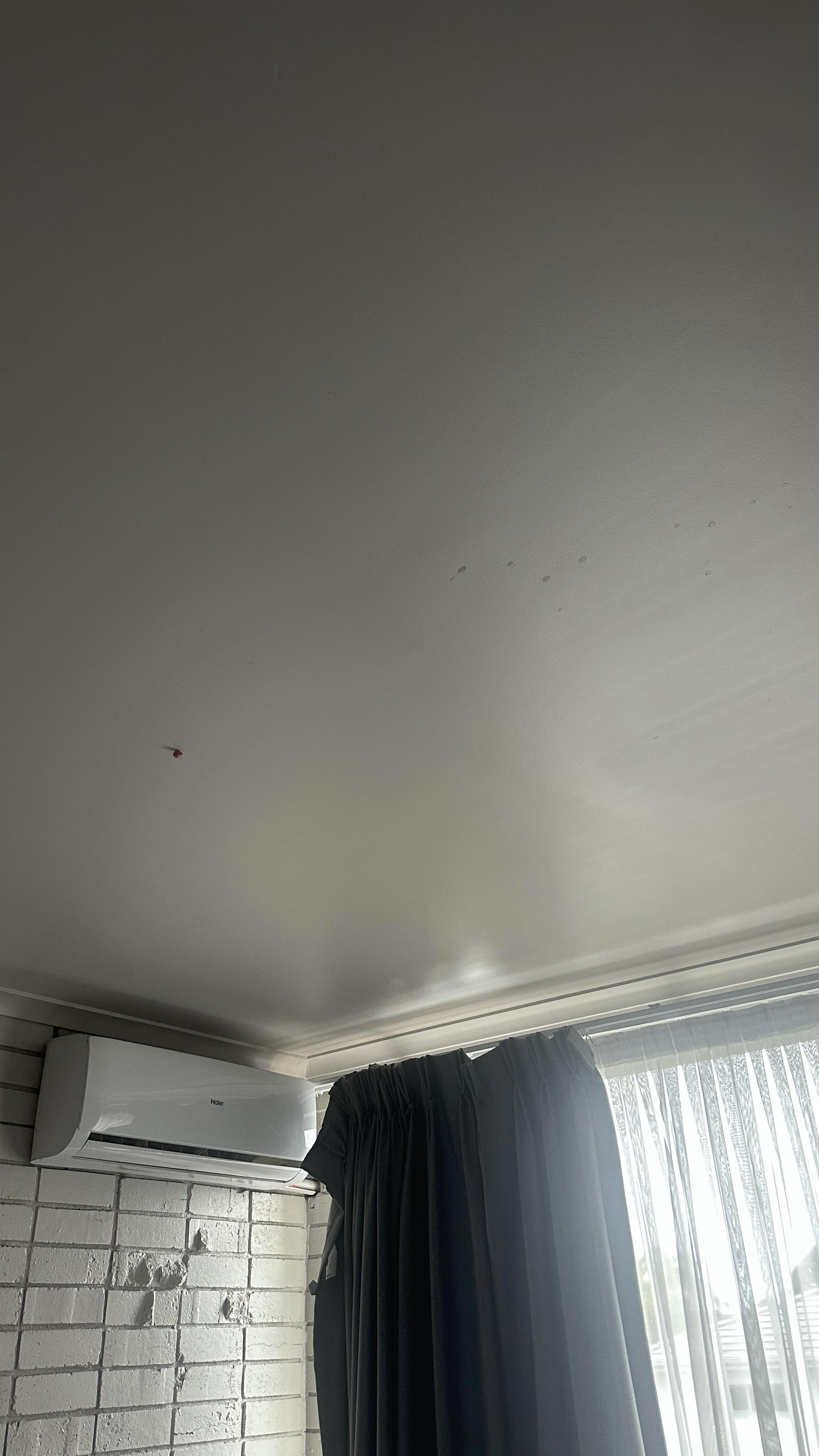 Gum and red liquid on the ceiling