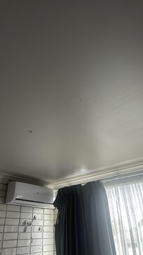 Gum and red liquid on the ceiling