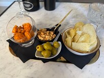 Snacks with our Prosecco. If anyone can tell me what the orange crisps were, I would love to know!!