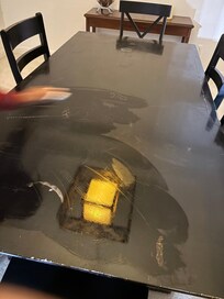 Dirty table being cleaned by us