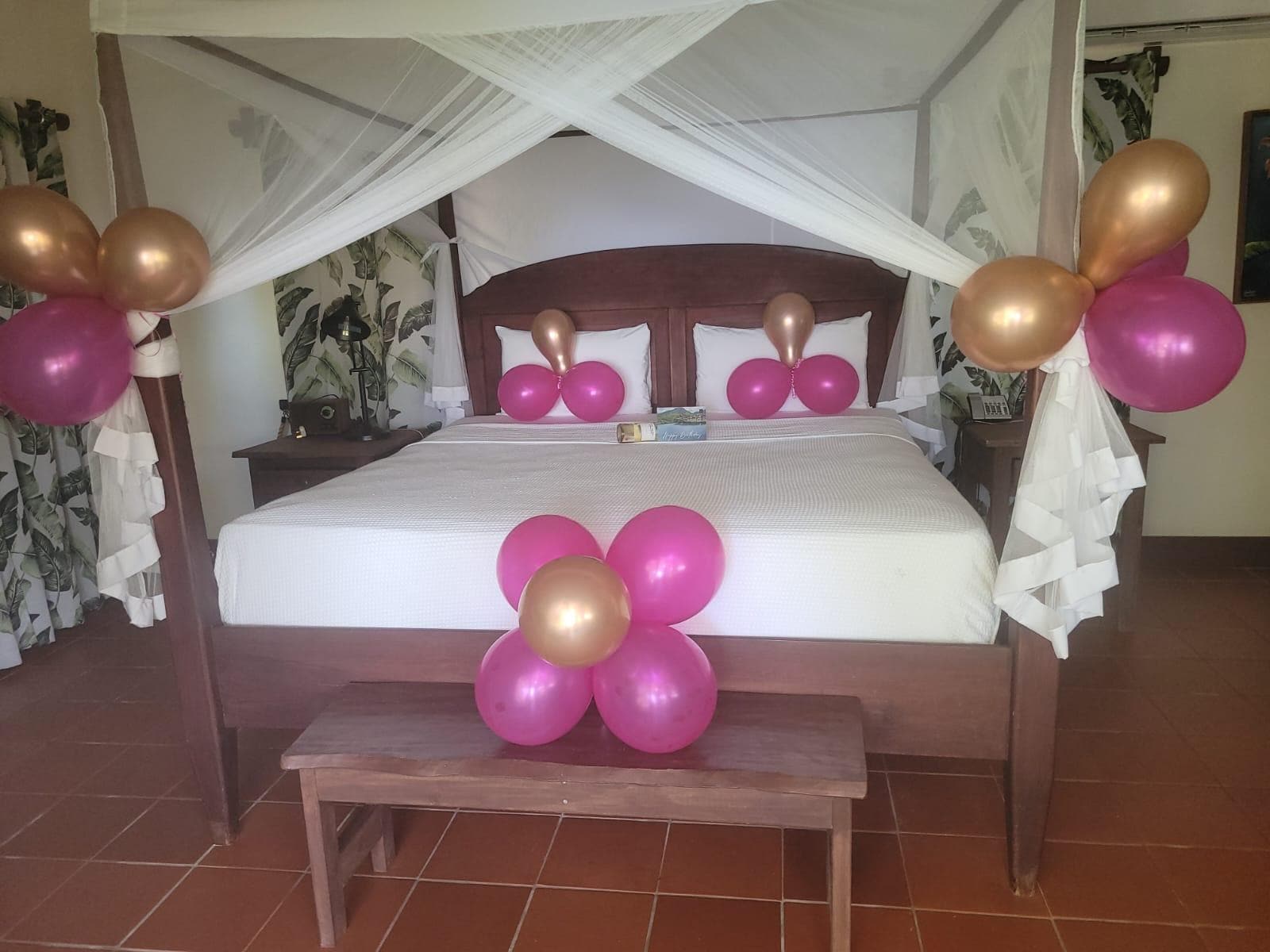 It was a birthday trip. The room was decorated with balloons, with a card and a bottle of wine.