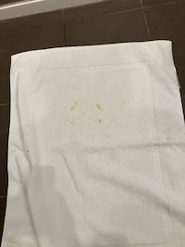 Stains on clean bath mat