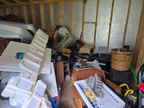 Advertised grill buried in shed which STINKS!